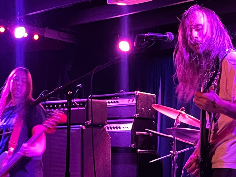 Two band members playing their instruments 