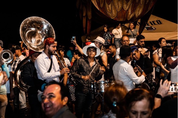 Sinaloense Banda performing for a crowd.  