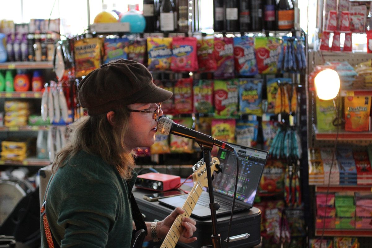 Matt singing among the snacks at Friendly Rio Market