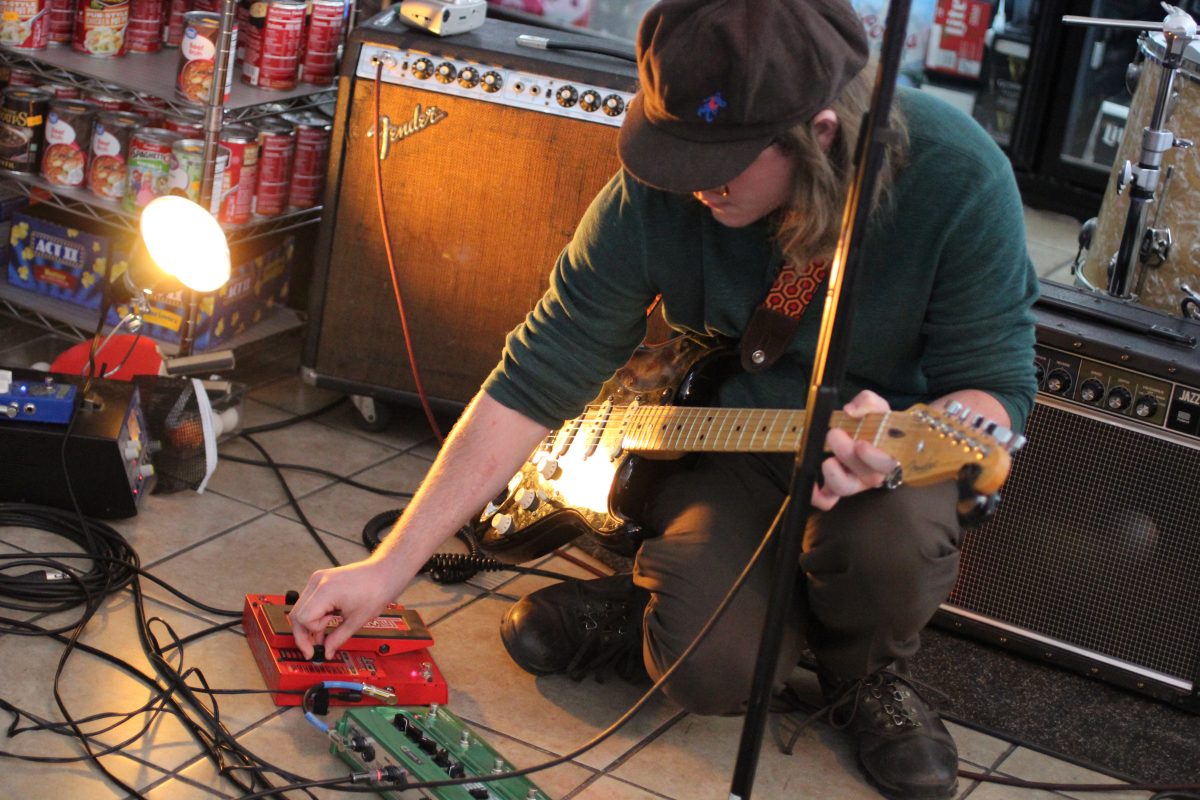 Matt messing with his pedals on the ground