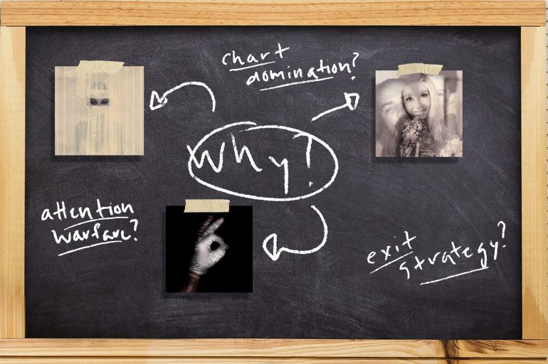 image of a chalk baord with three Drake albums attached to it and writing in chalk question why Drake dropped three albums at once