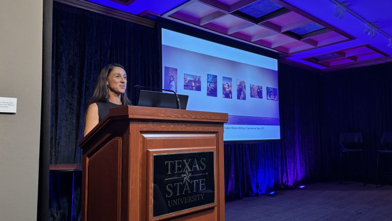 M. Jenea Sánchez speaks at Texas State podium on the left, while her presentation is presented on the right.