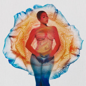 Kali stands and closes her eyes as a rose petal blends with her