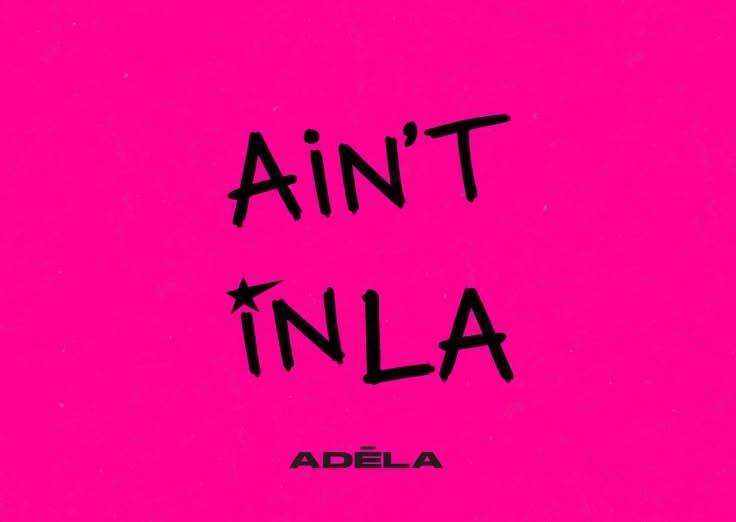 Black handwritten-style text against a hot pink background that reads "AIN'T IN LA" with a small star above the letter "I", and the artist name "Adéla" printed below in a bold font