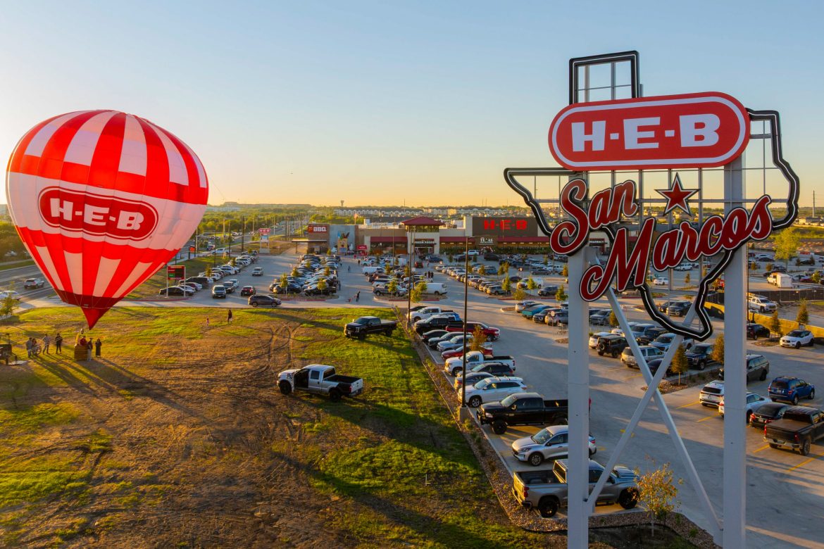 An early morning sunrise behind the San Marcos H-E-B grand opening event.